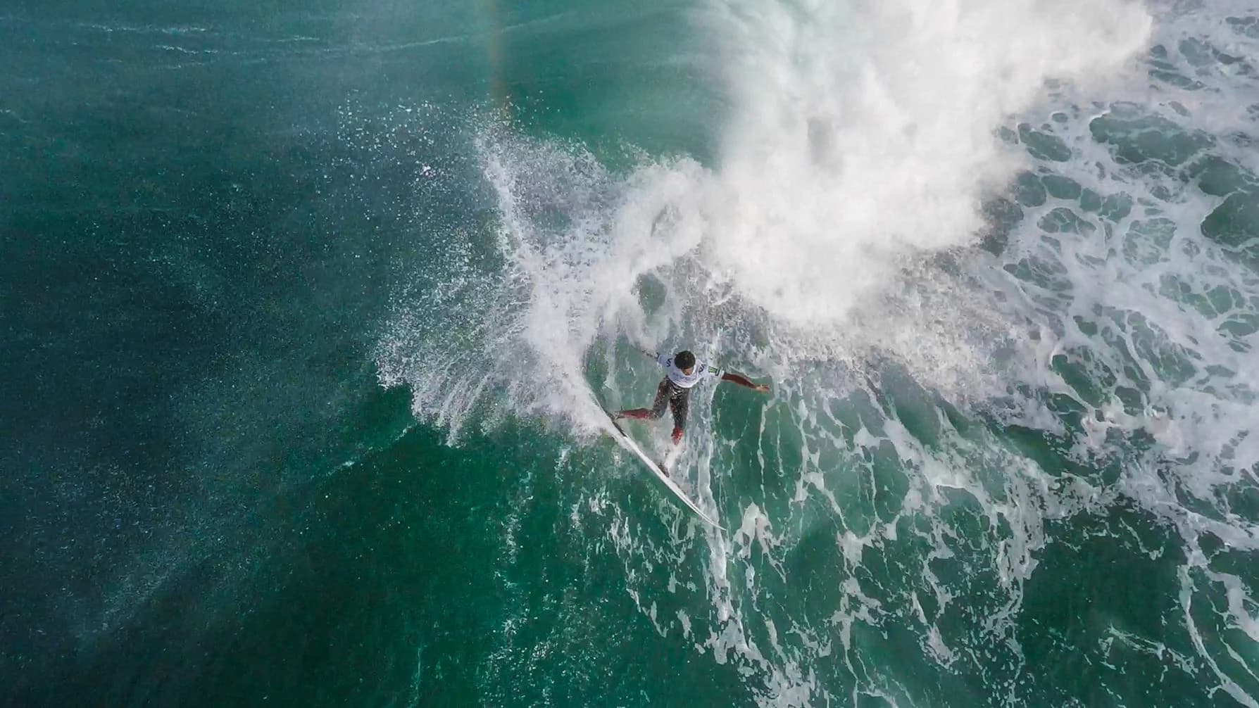Surfer captured from the air during an aerial cinematography production